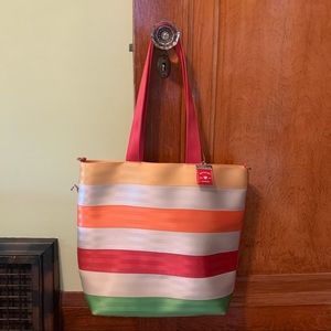 Harvey’s medium seatbelt tote citrus colors, with charm.